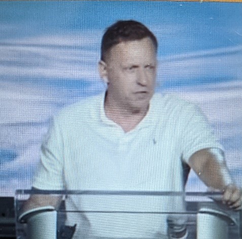 A man wearing a white shirt